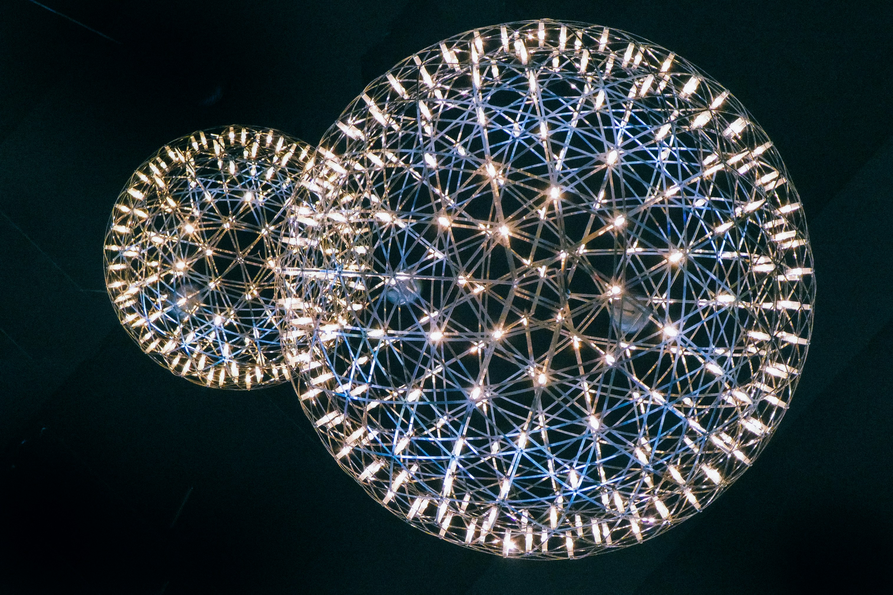 Two light fittings that look like firework starbursts.